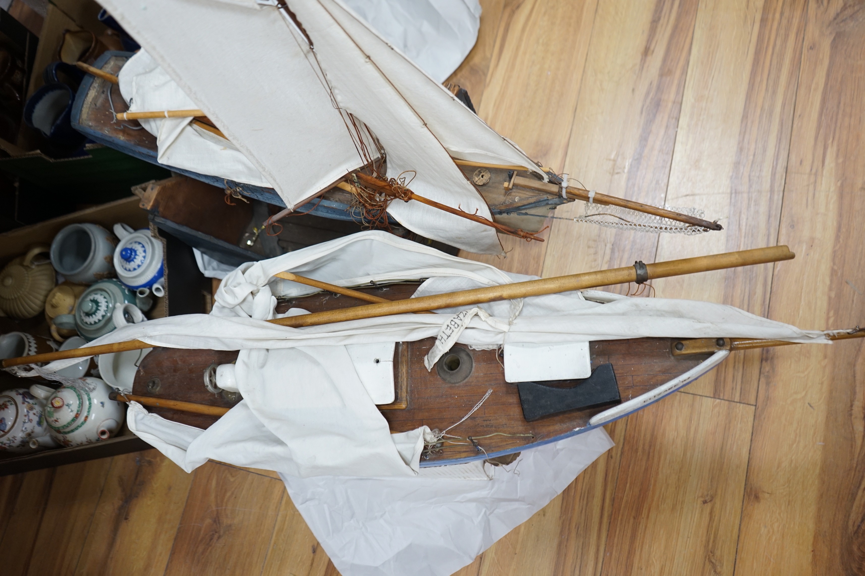 Two large over-painted pond yachts, largest 91cms